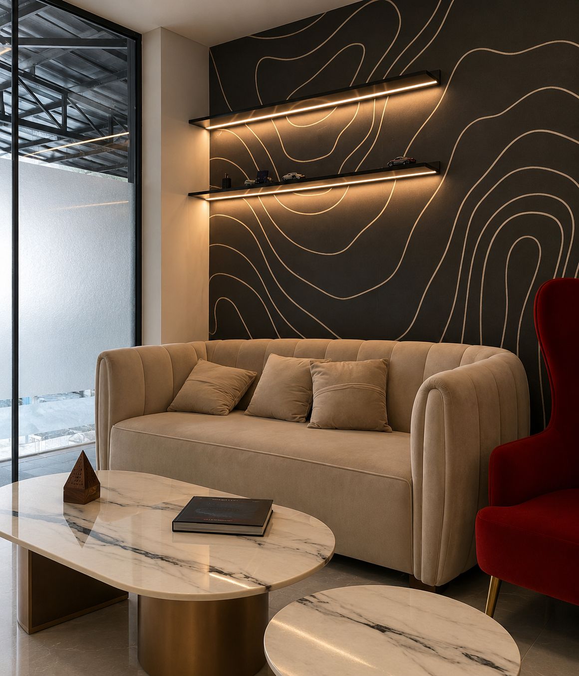 Dining nook with gallery wall of black-and-white prints and round pedestal table.